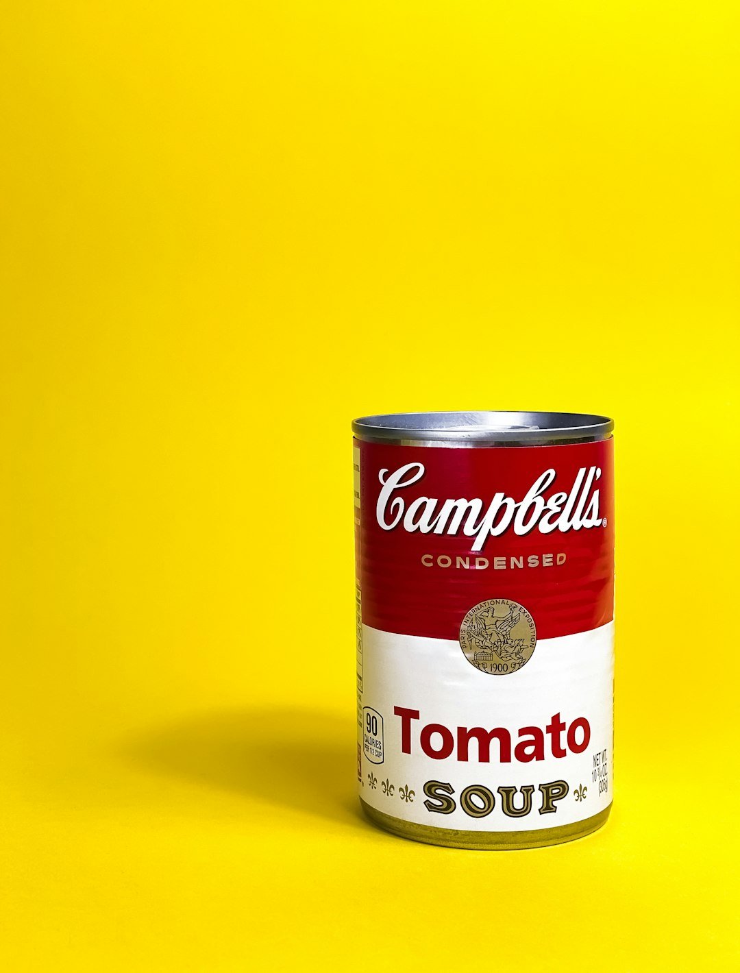 a can of soup on a yellow background