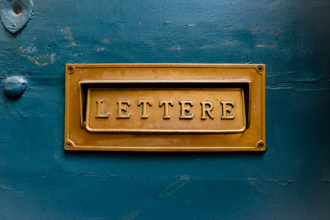 brown Lettere signage on teal trwall