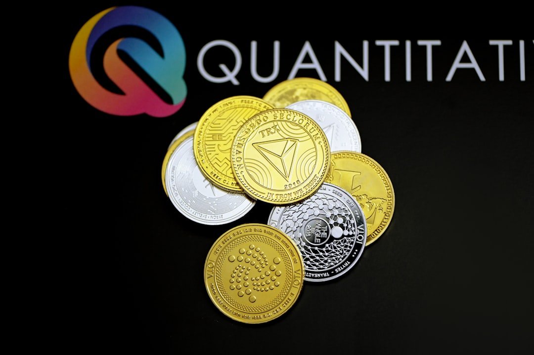 a pile of coins sitting on top of a black table